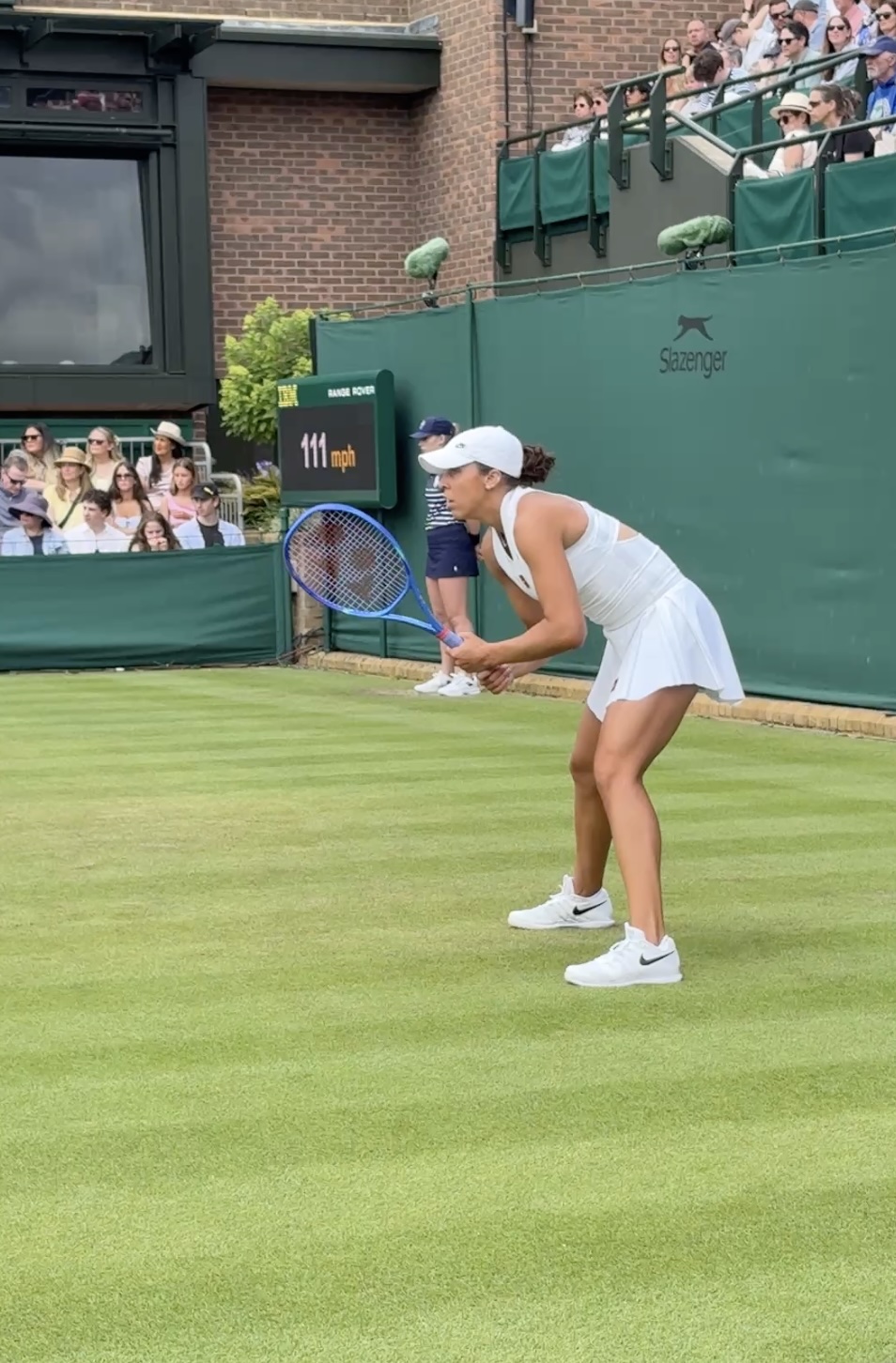 Tennis player preparing to receive serve at Wimbledon